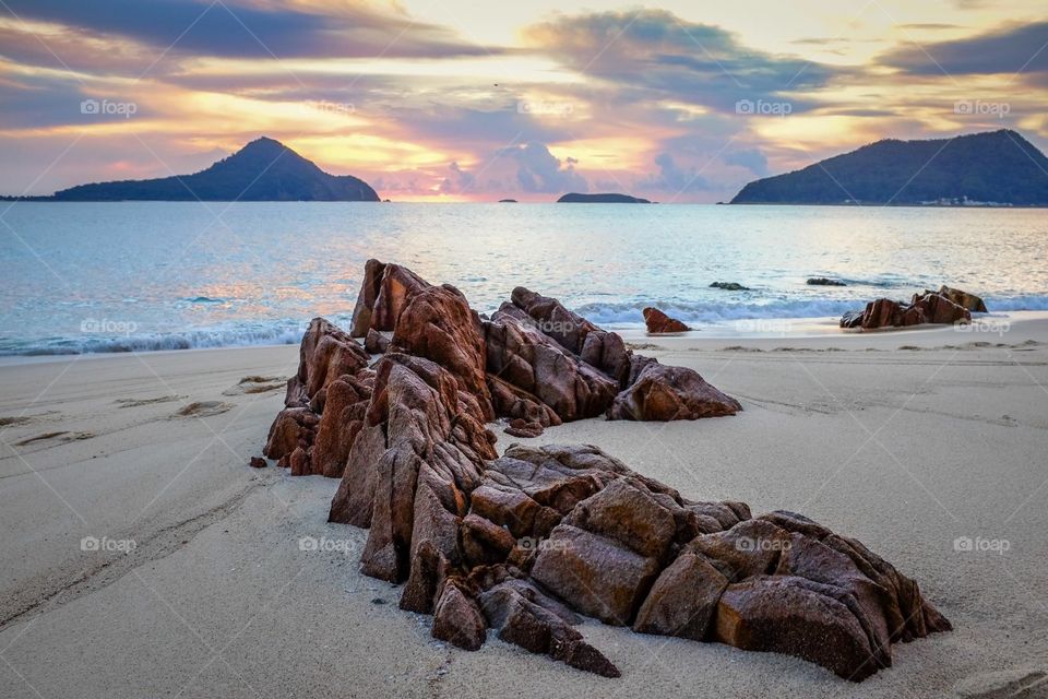 Rocky beach with island background