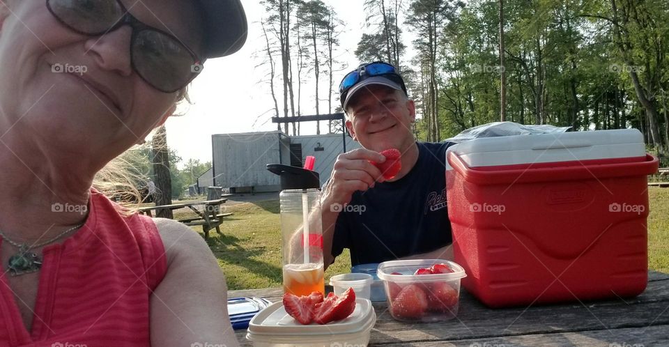 Couple Having A Picnic In The Park