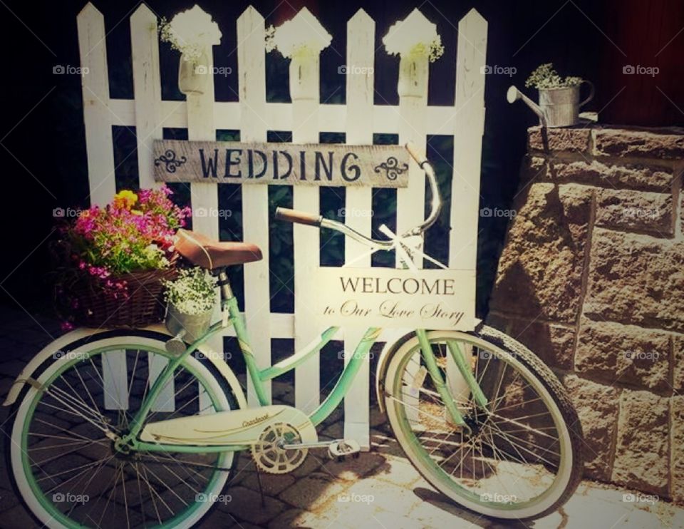 Romantic wedding Bike. Greet guest with a bike and flowers