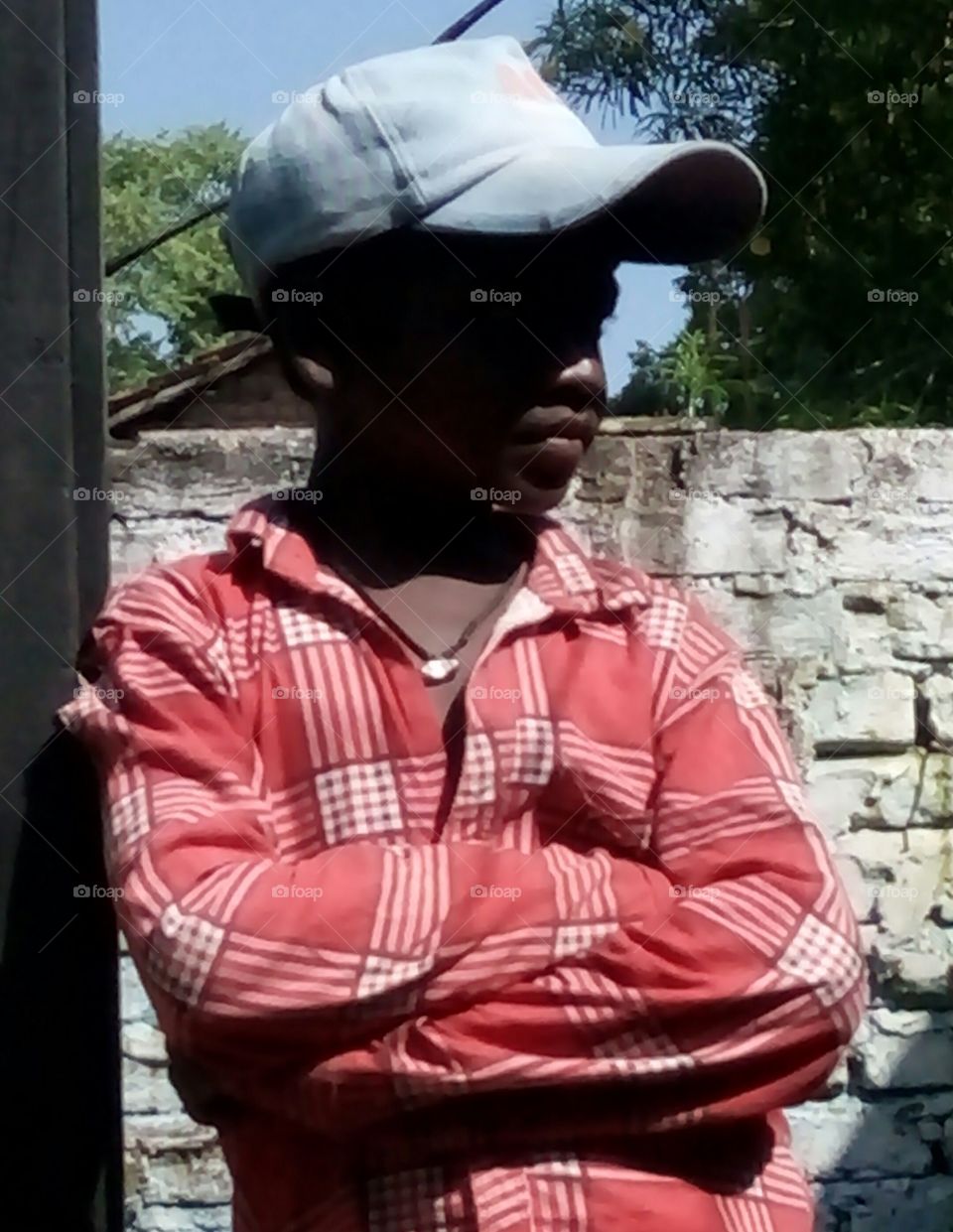 Photographs of a boy / Photograph of an Indian boy / Photograph of a boy wearing a cap / Photograph of a boy wearing a red shirt / Photograph of a Hindustani boy / Photograph of a poor boy / Photograph of a decent boy/real photo of boy