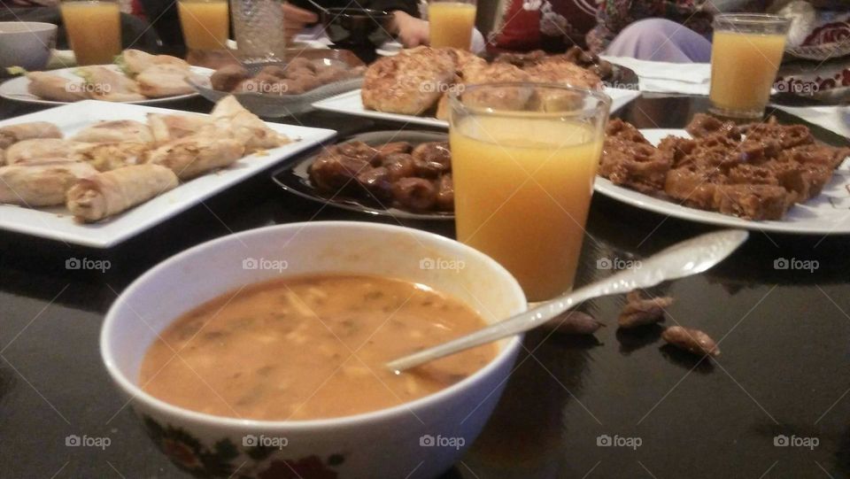 Moroccan soup and orange juice served in Ramadan month