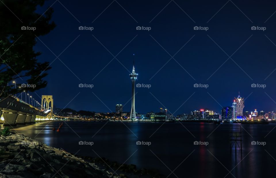 The Sai van bridge and Macau Tower during blue hour time. Captured from The other side of Taipa Island.