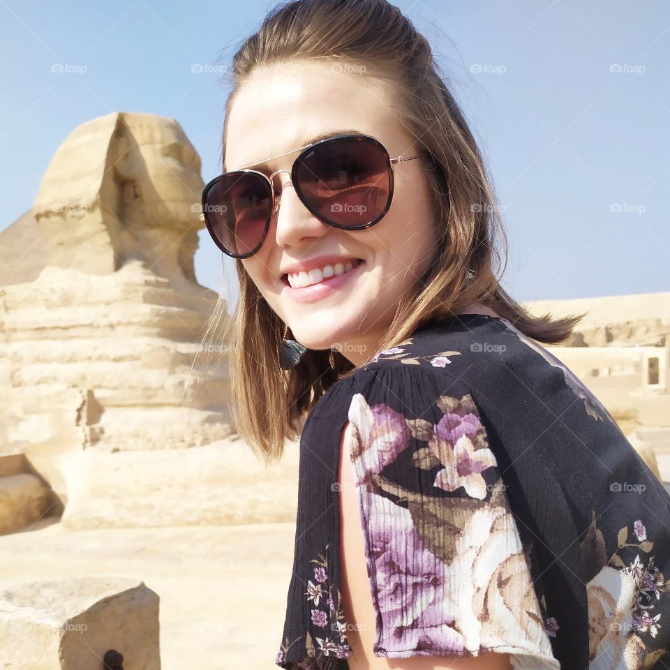 great Sphinx with lovely photo with lovely woman with beautiful smile and sunglasses.