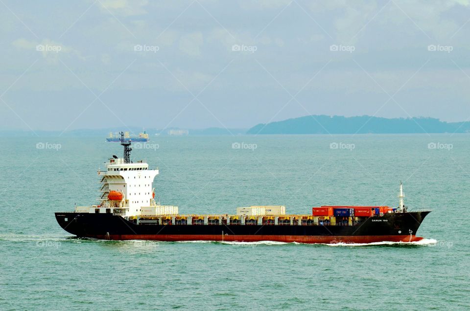 Ship passing through Malacca Straits