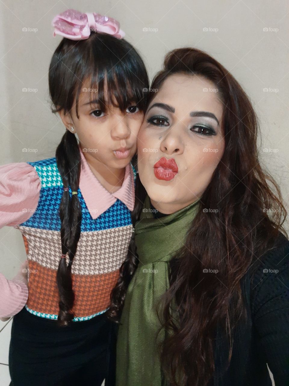 aunt and niece sending kisses