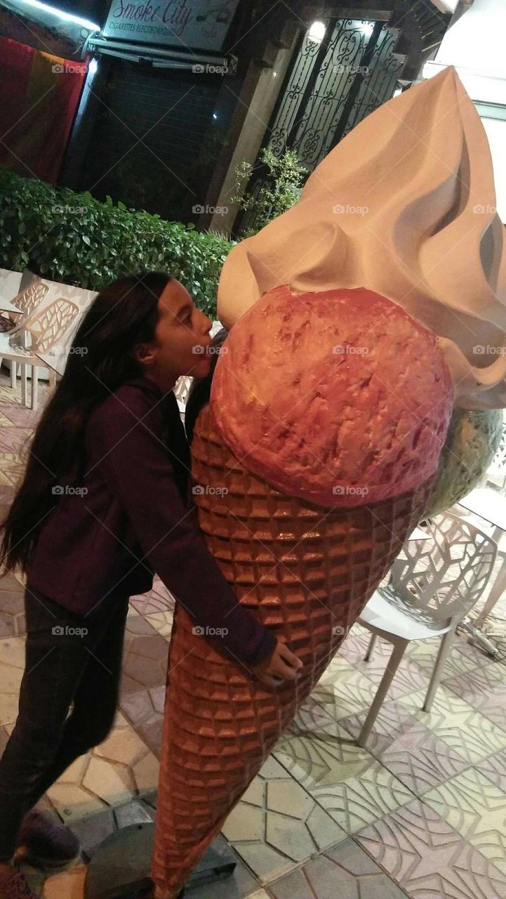 A girl and the biggest ice cream.