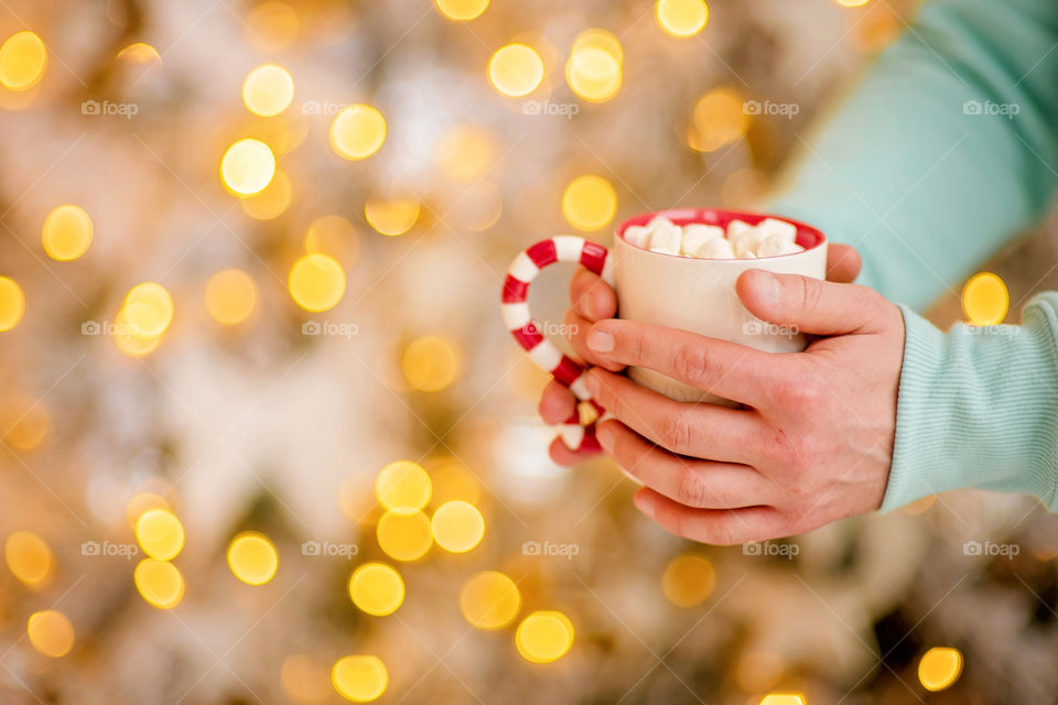 cup of coffee in a cozy festive Christmas atmosphere