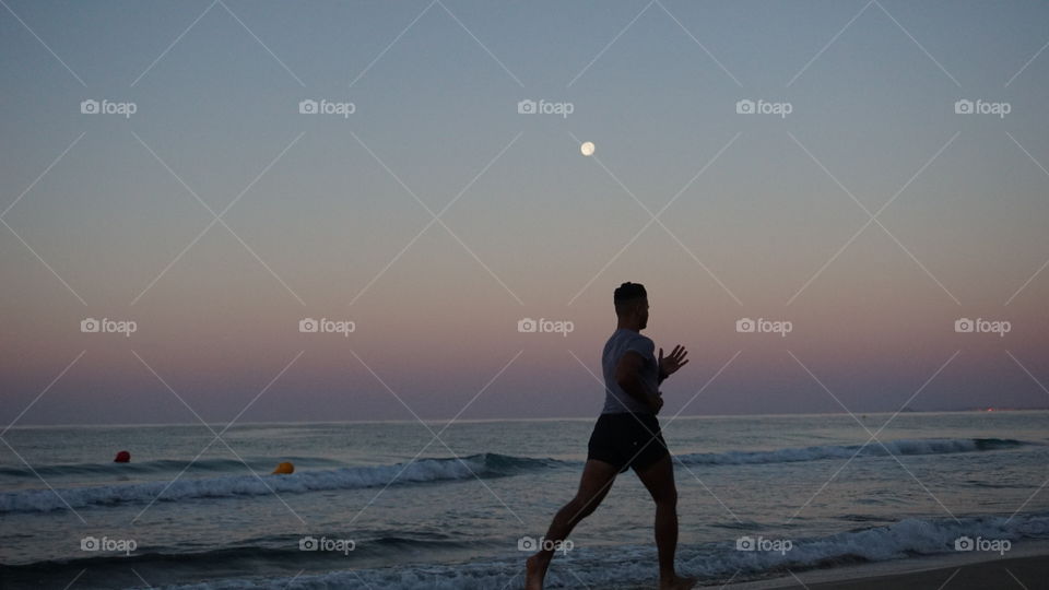 Sunrise#beach#human#walk#colors#sea#waves#moon#sport