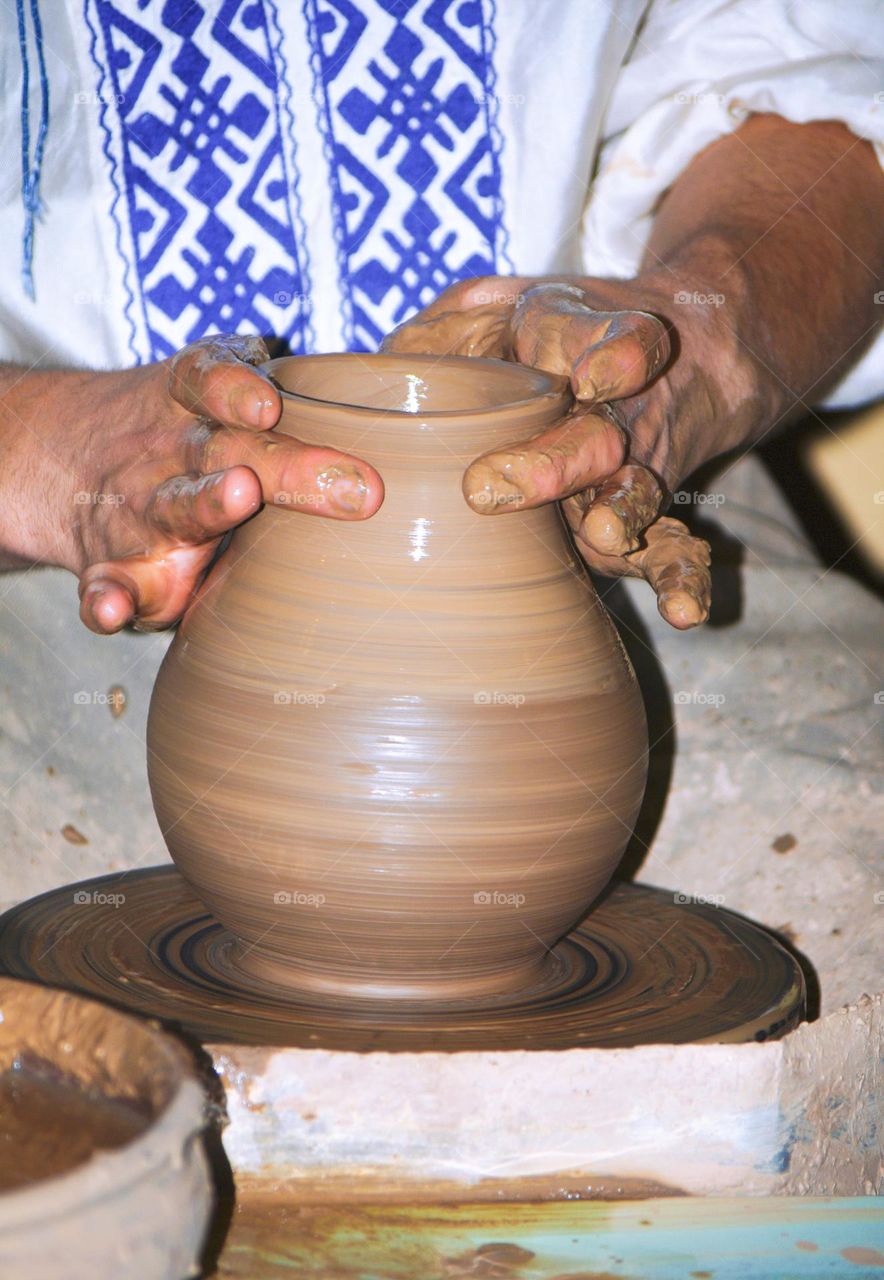 potter makes pottery out of clay