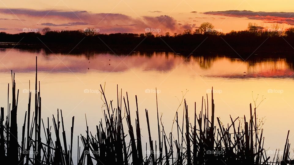 Gorgeous night in this small town beach area with sun setting below the horizon. 