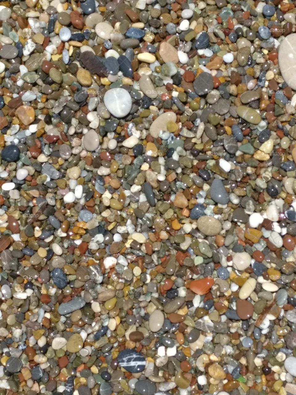 Small stones on the beach of the Mediterranean