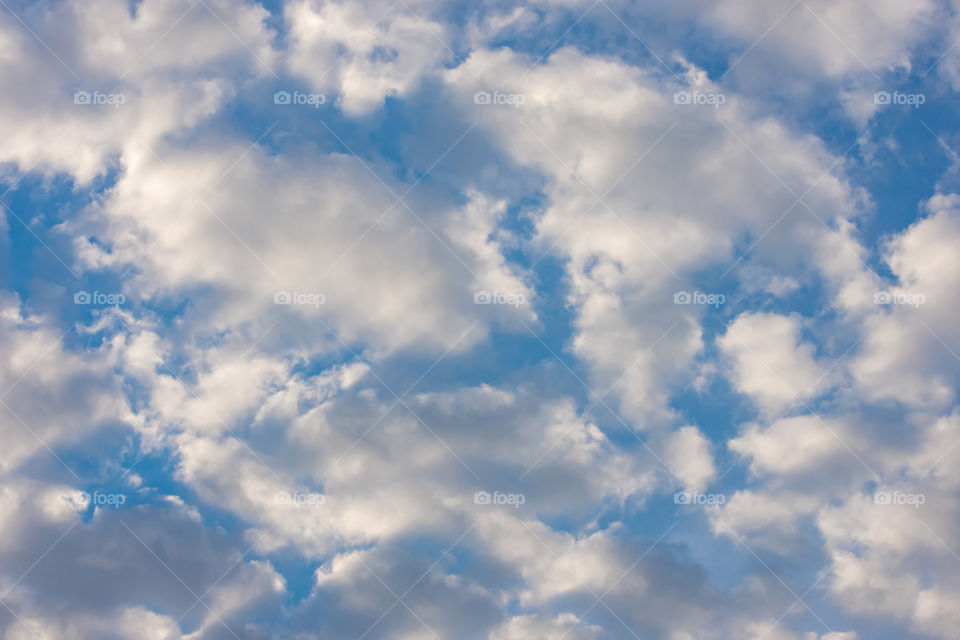 The beauty of the sky with clouds and the sun.