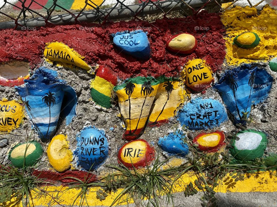 Beautiful little painted rocks along side Main Street in Ocho Rios Jamaica 