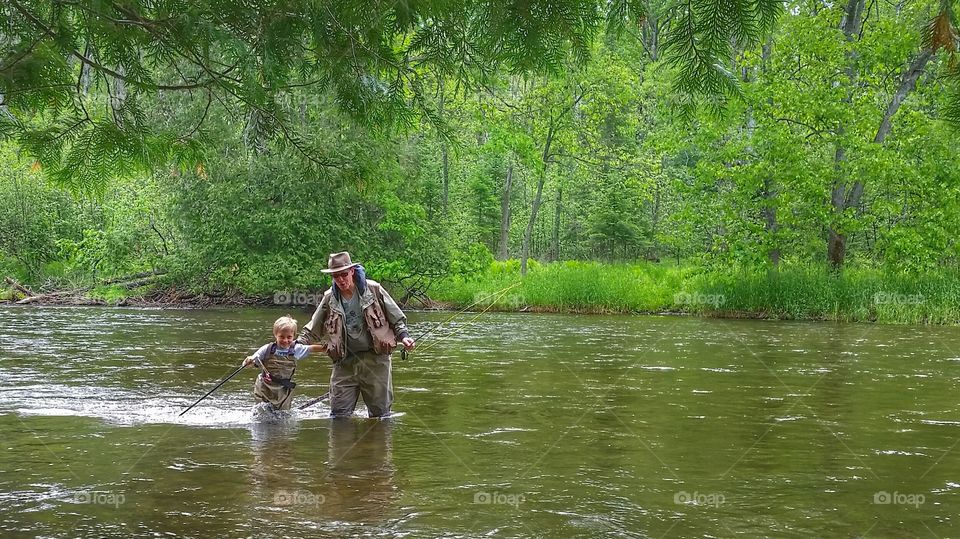 helping to wade the river