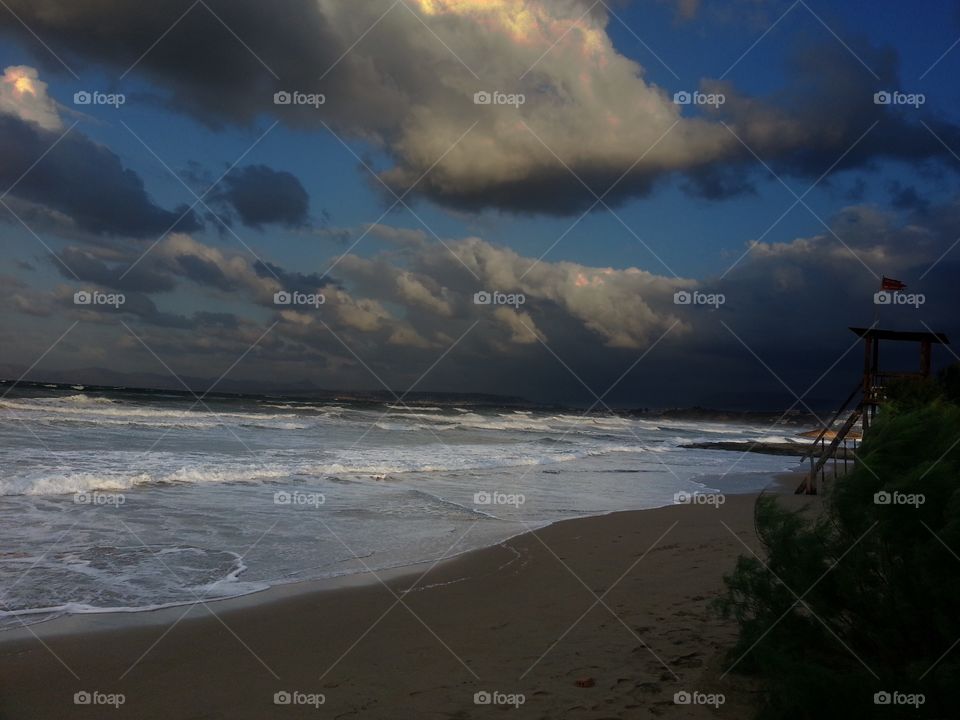 Storm clouds over beach