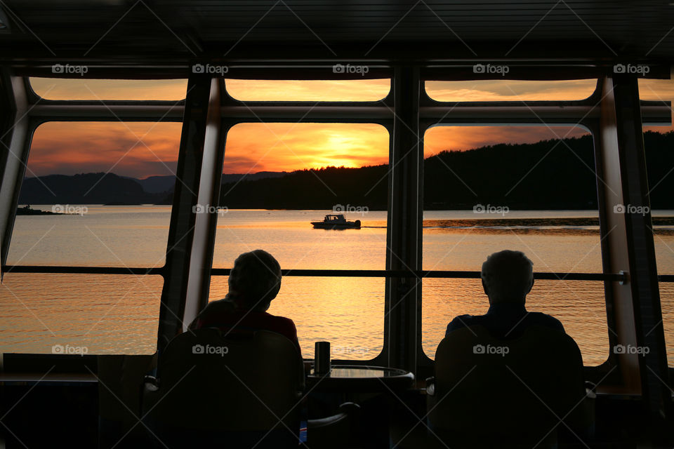 Couple in front of a window. 