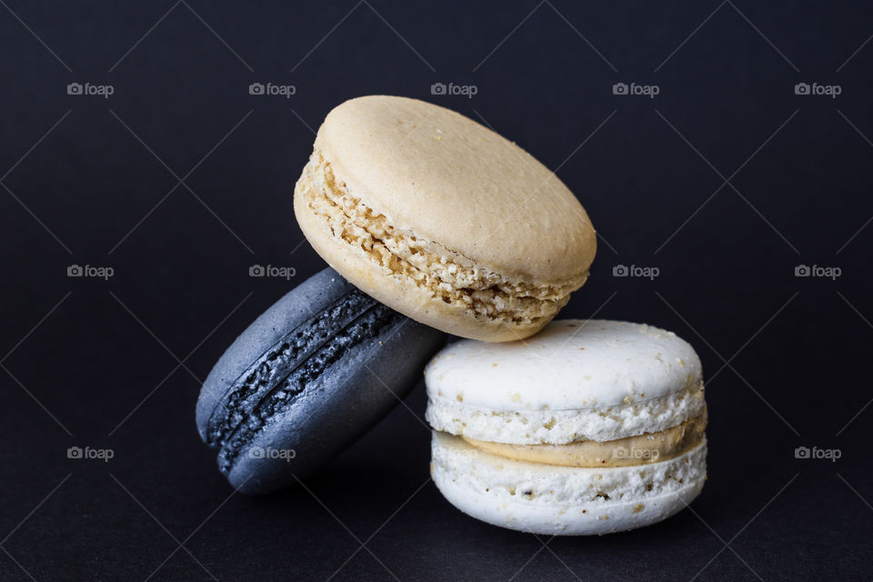 macarons on a black background