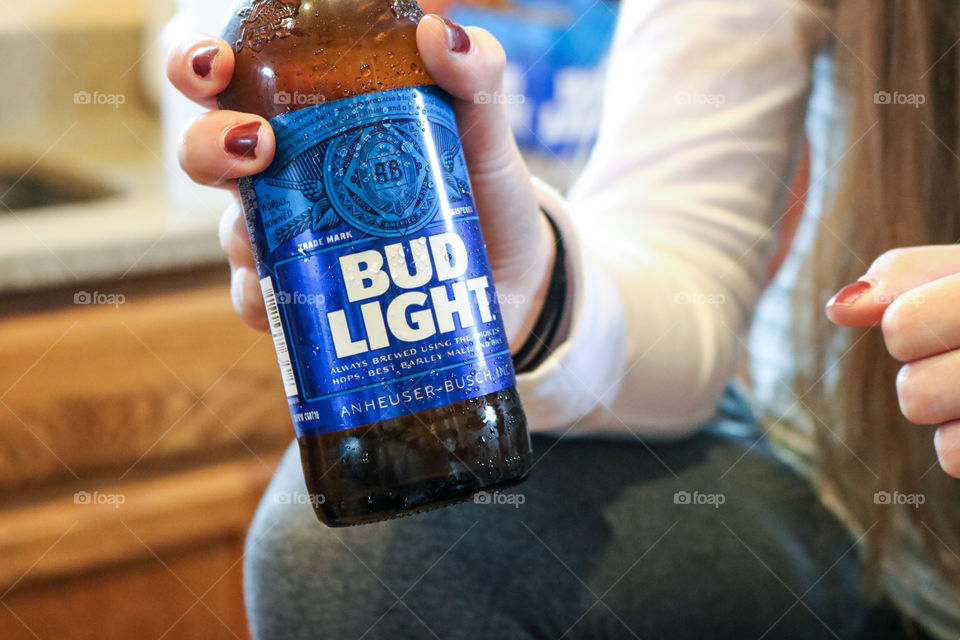 Bud Light- woman holding a refreshing bud.