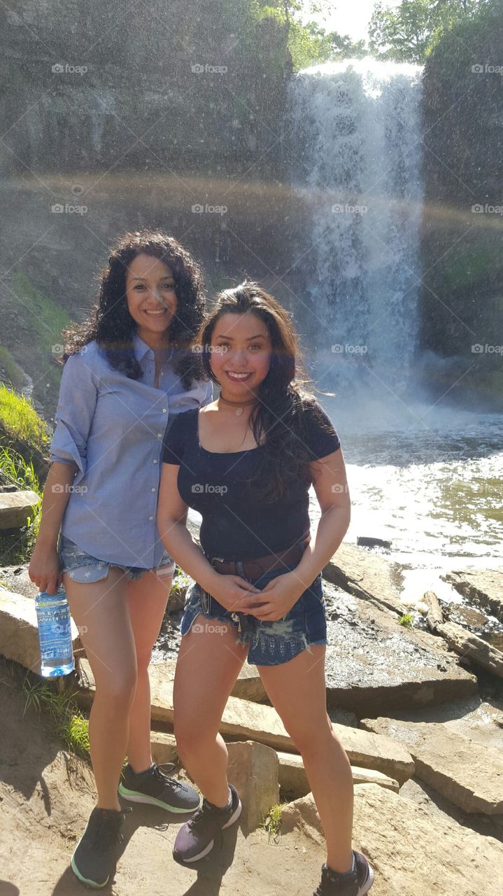 Women in front of  beautiful waterfall