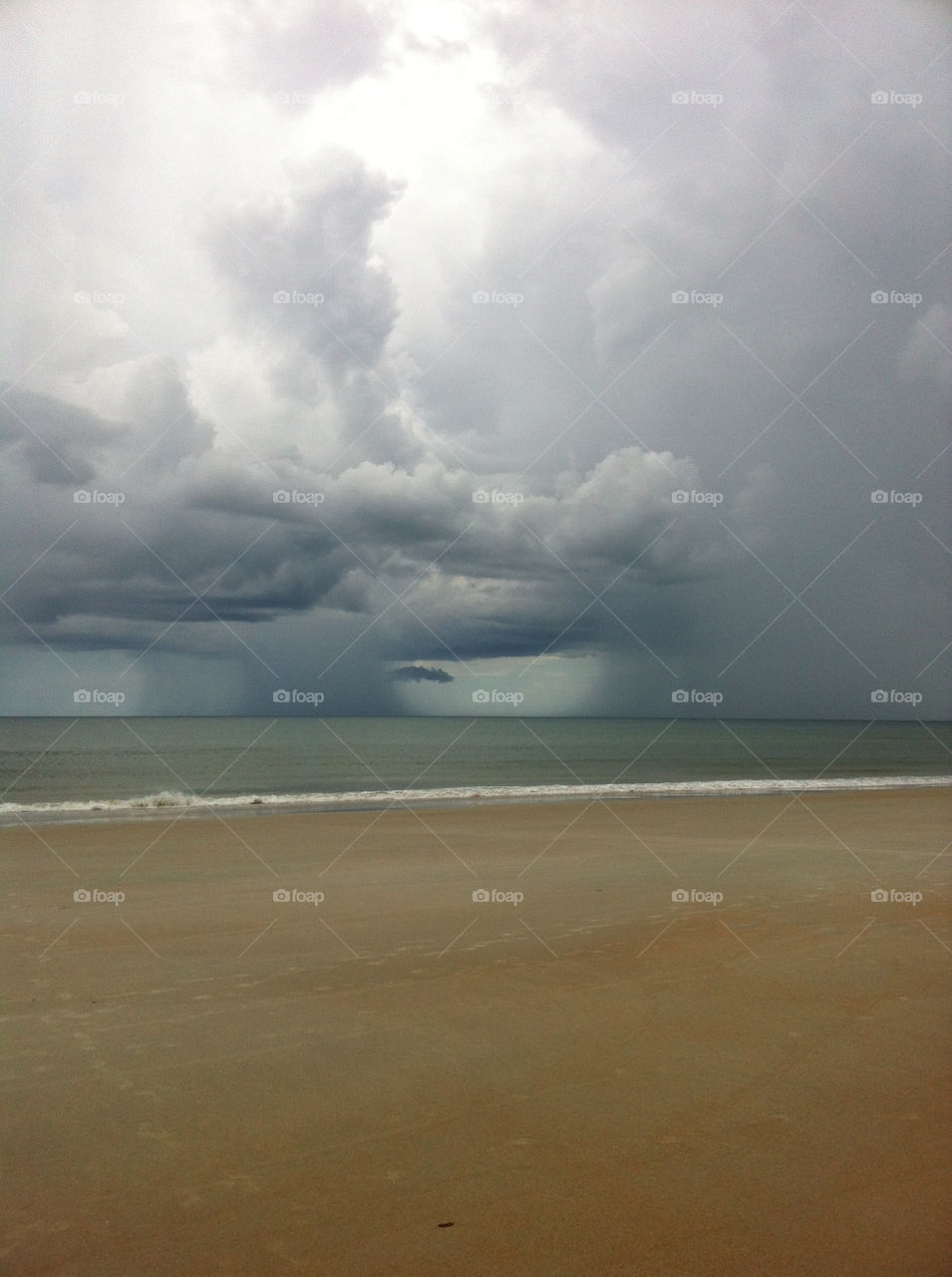 beach ocean clouds rain by dmelhorn