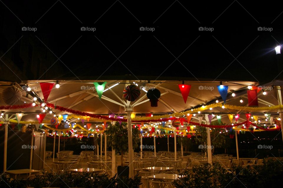 empty tables at evening during festas de lisboa