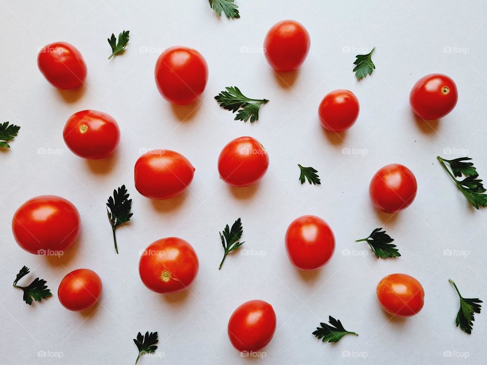 cherry tomatoes scattered on a white background