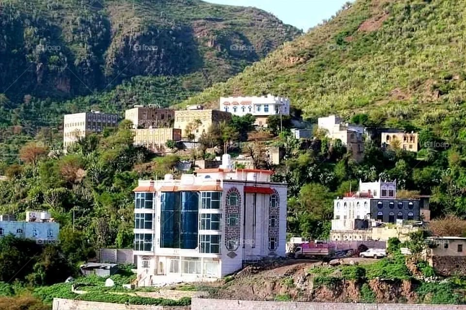 A stunning view of green mountains covered in fog in Yemen