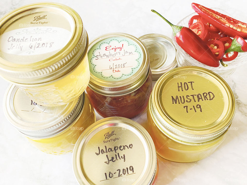 Homemade sweet and hot canned jelly and mustard 