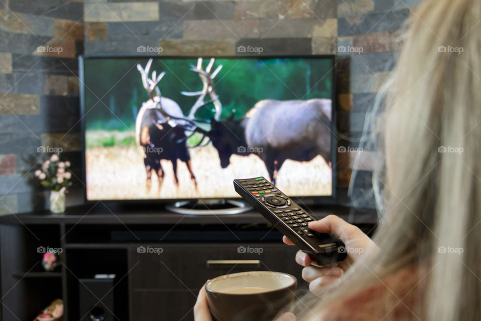 girl is watching TV