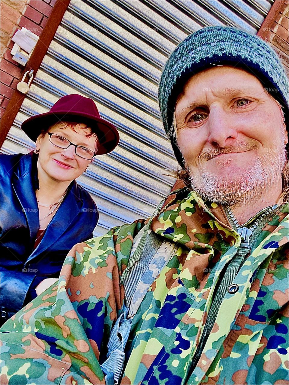 Petra and Timothy, two passionate LIME electro scooter riders have taken a rest on a stoop on Waverly St between Fulton and Gates. They decided to take a portrait picture. December 2021. Hypnotic Productions 