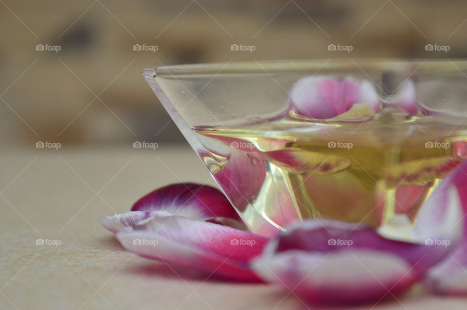 Close-up of oil and rose petals