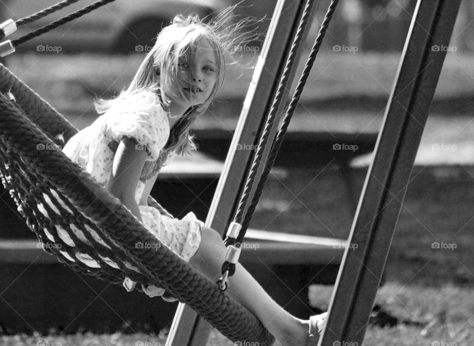 Swinging. Girl swinging