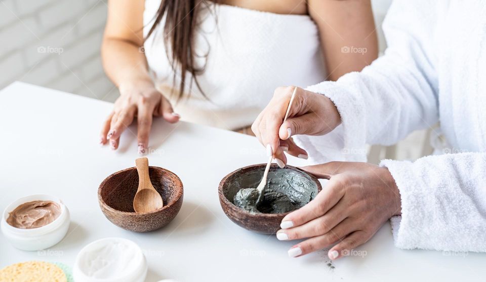 woman hand holding beauty products