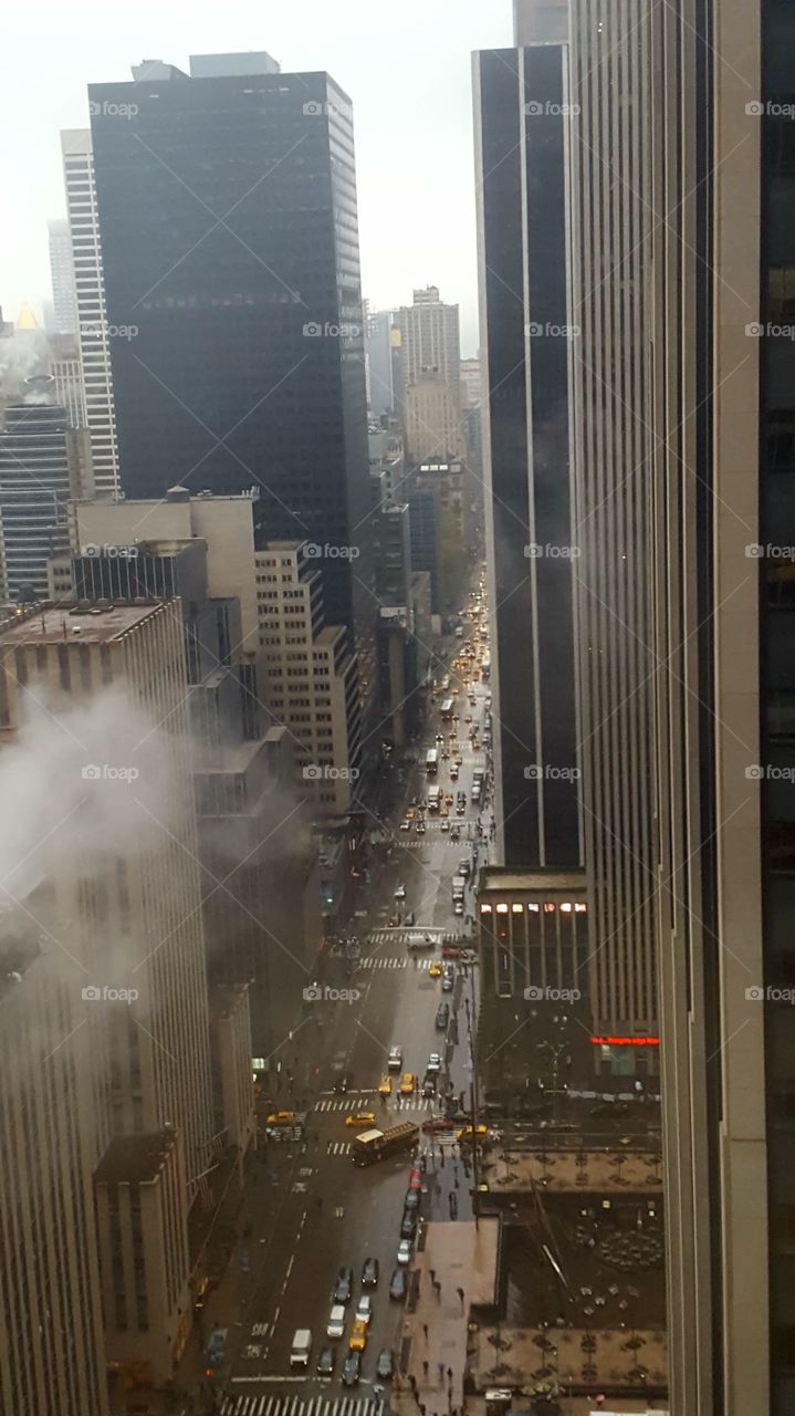 midtown Manhattan traffic in the morning rain