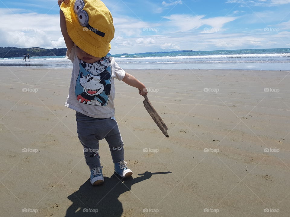 toddler boy at a beach near Auckland,  New Zealand