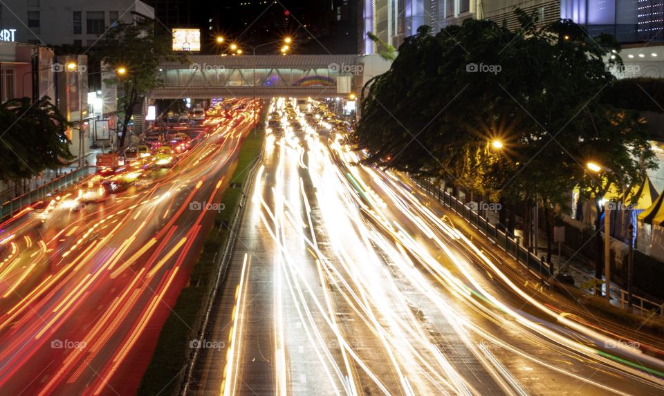 Vehicle head lamp light in front of the most famous shopping center MBK in two direction, Bangkok Thailand