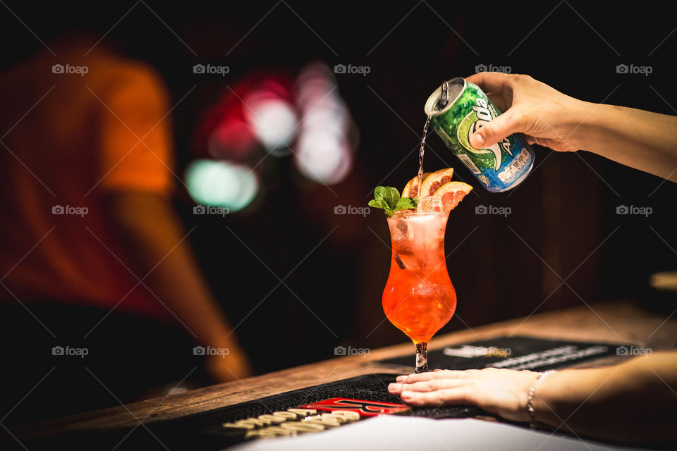 Woman preparing a drink