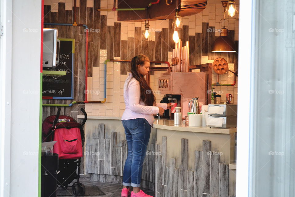 Woman buying coffee in a coffee shop