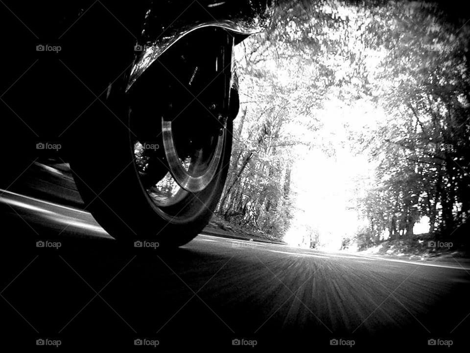 low down motorcycle moving shot