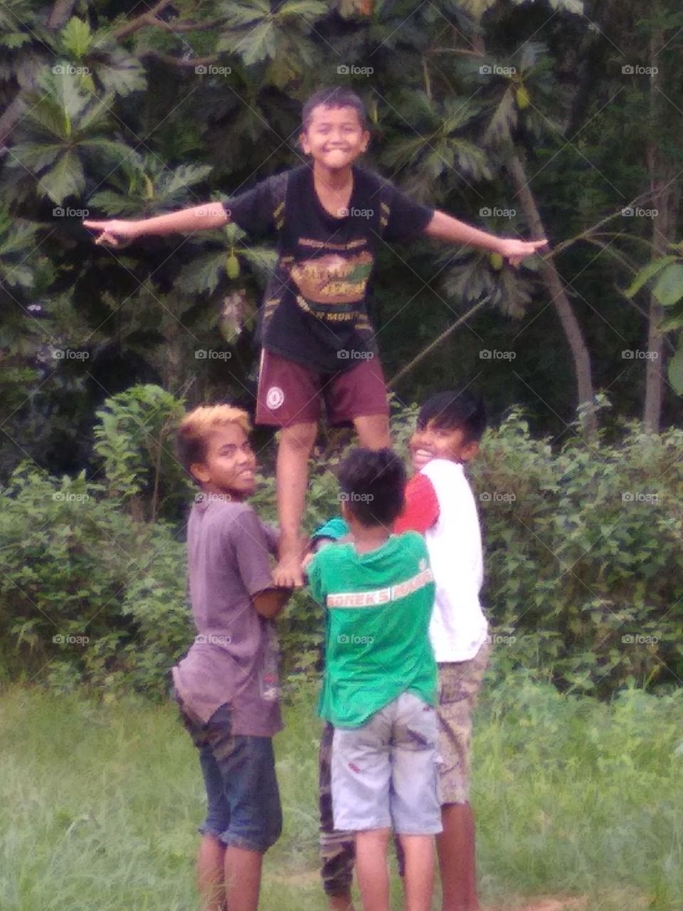 The village boy is happy to play happily