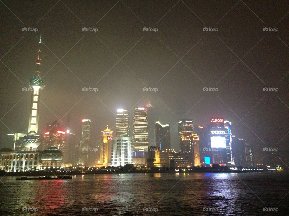 Shanghai  glow. Shanghai Pearl  and skyline seen from The Bund, Shanghai, China. 