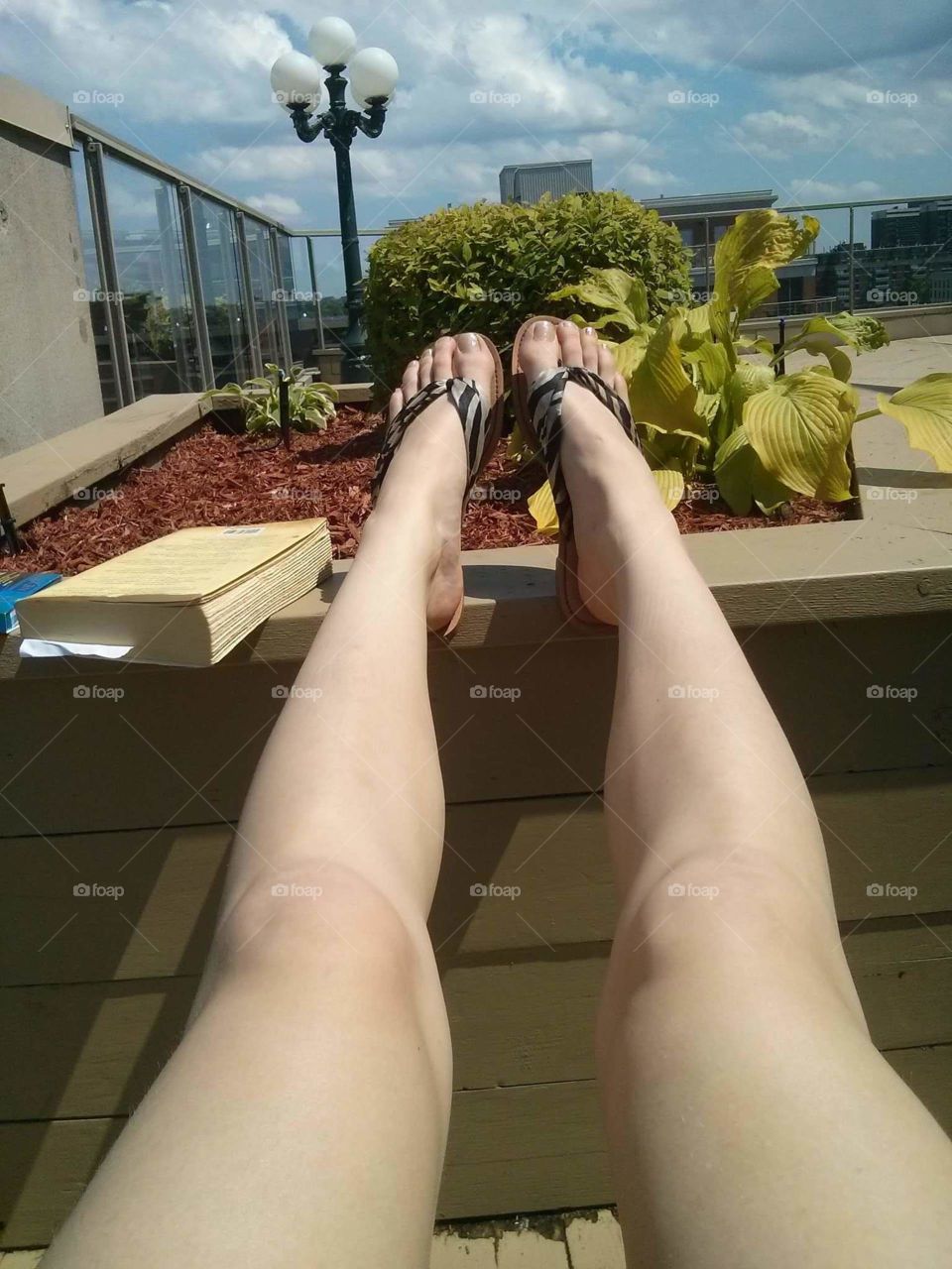 Rooftop Sun bathing freshly shaved legs