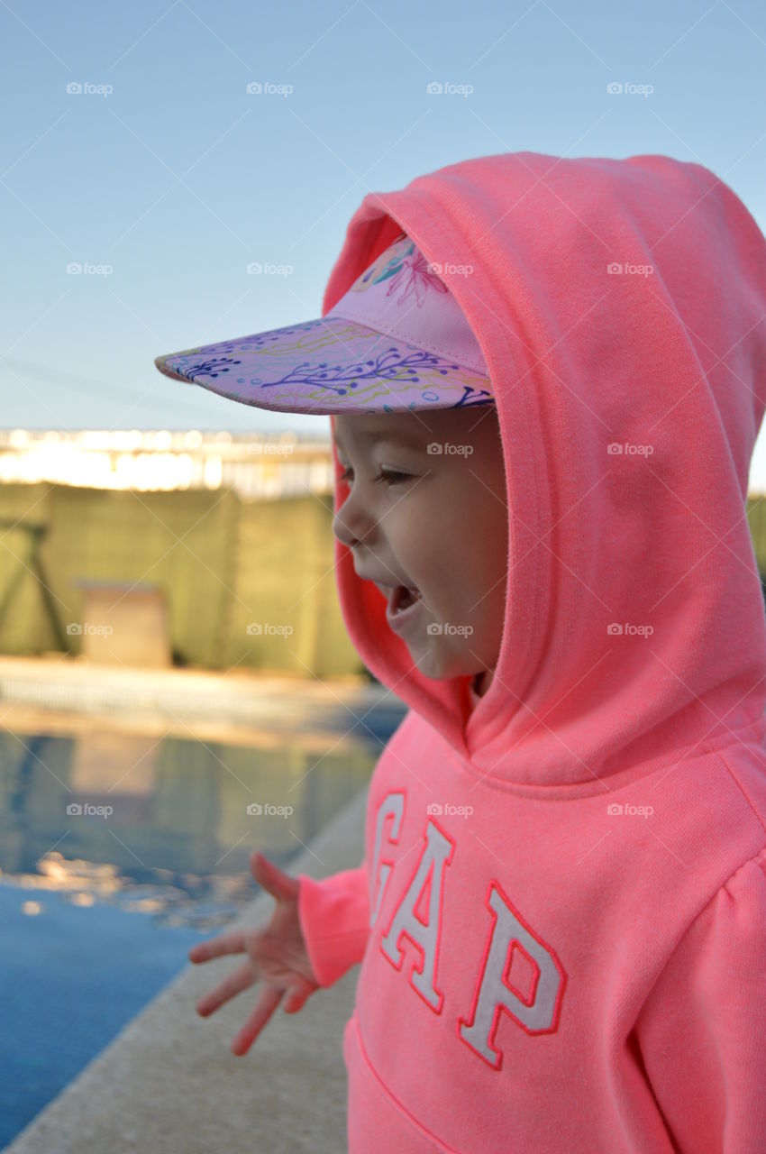 Her cheeks were bright with color and her eyes shone and her mouth turned up in its small childlike smile