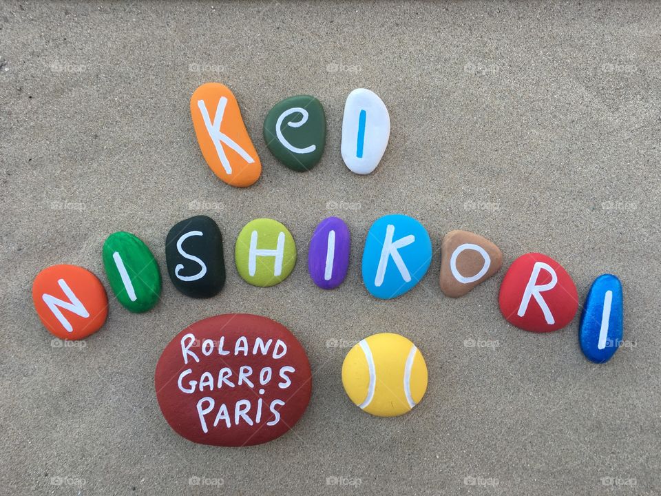 Kei Nishikori, japanese professional tennis player at Roland Garros, souvenir on colored stones 