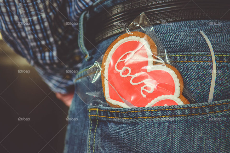 Heart shape valentine gift in man jean pocket