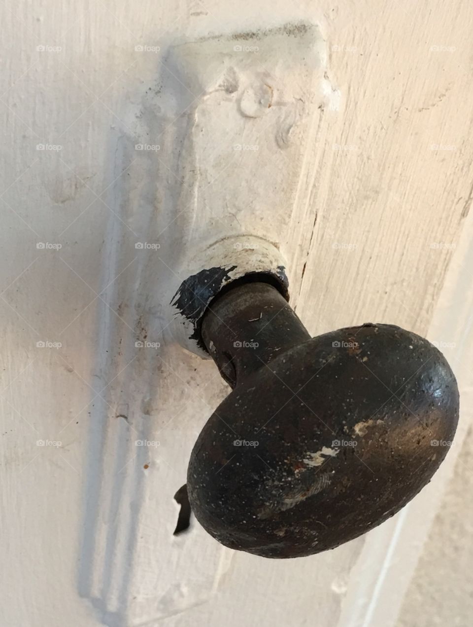 Old metal doorknob with keyhole, rusted, old door, architectural element, painted door