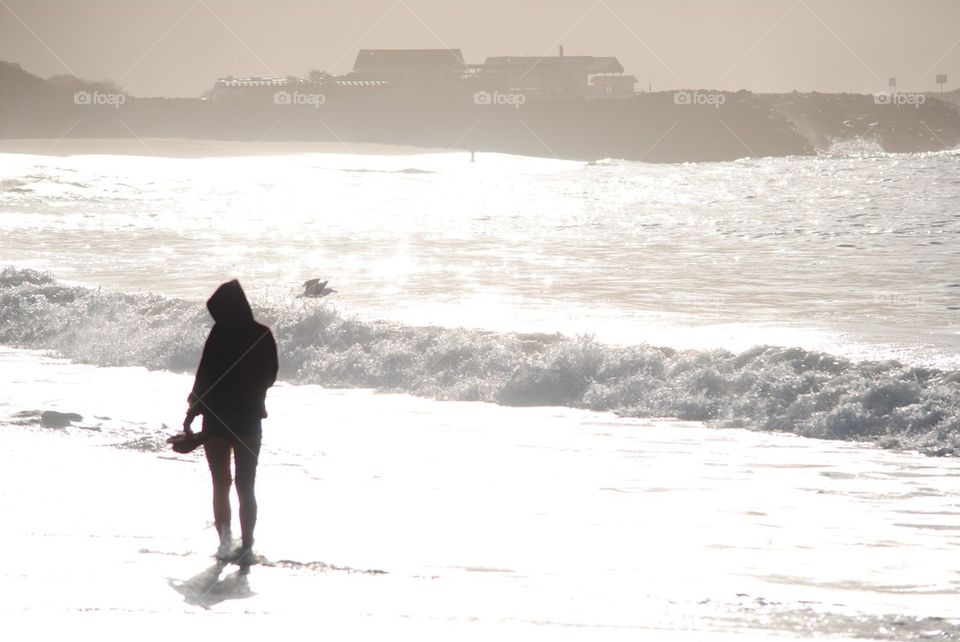 Girl walking on the beach