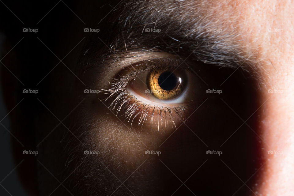 Macro of male eye inthe dark