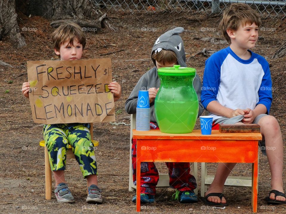 Portrait of child holding poster