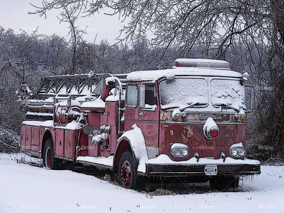 Icy and snow covered fire engine, fire engines abandoned, blizzard conditions in the Midwest, snow covered landscape 